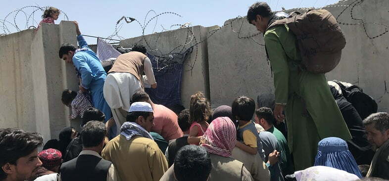 Afghan struggle to enter Kabul Airport to flee the country, August 2021.Getty Images